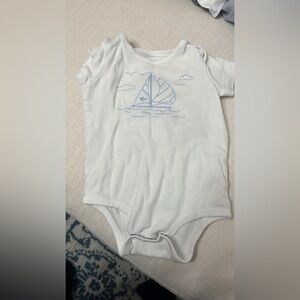 Ralph Laure. White Baby One-Piece Bodysuit with Blue Sailboat Embroidery